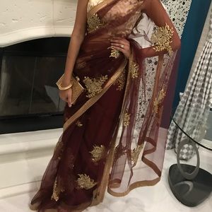 Beautiful fully embroidered saree with gold lace border. Color: Maroon, Wine